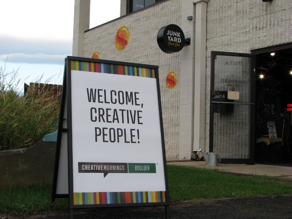 Welcome, Creative People! sandwich board outside Junkyard Social Club