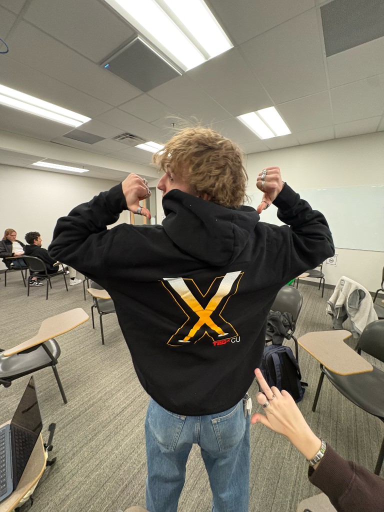 Back of a TEDx CU hoodie with a large X graphic