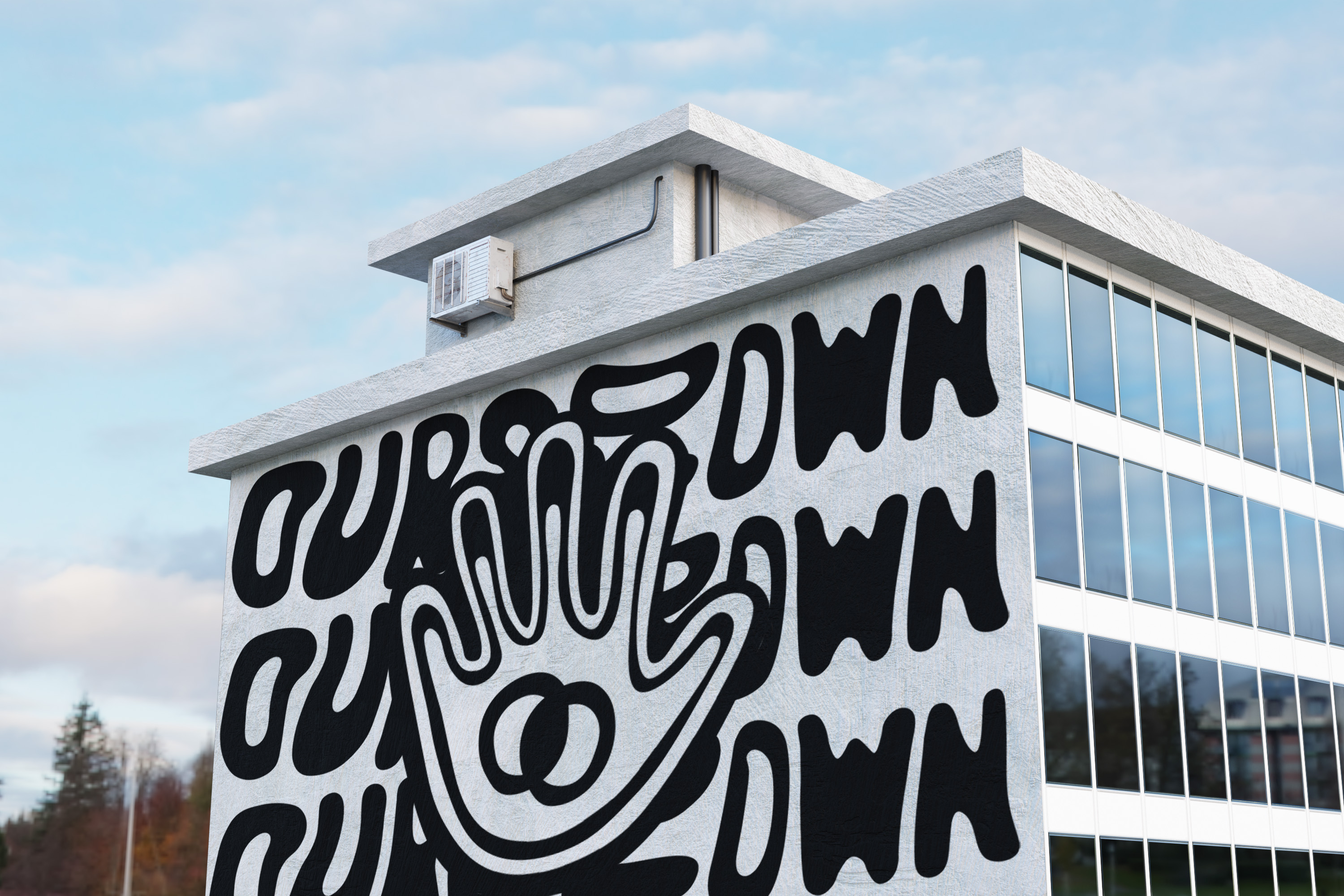 Large black-and-white Ours To Own mural on the side of a building