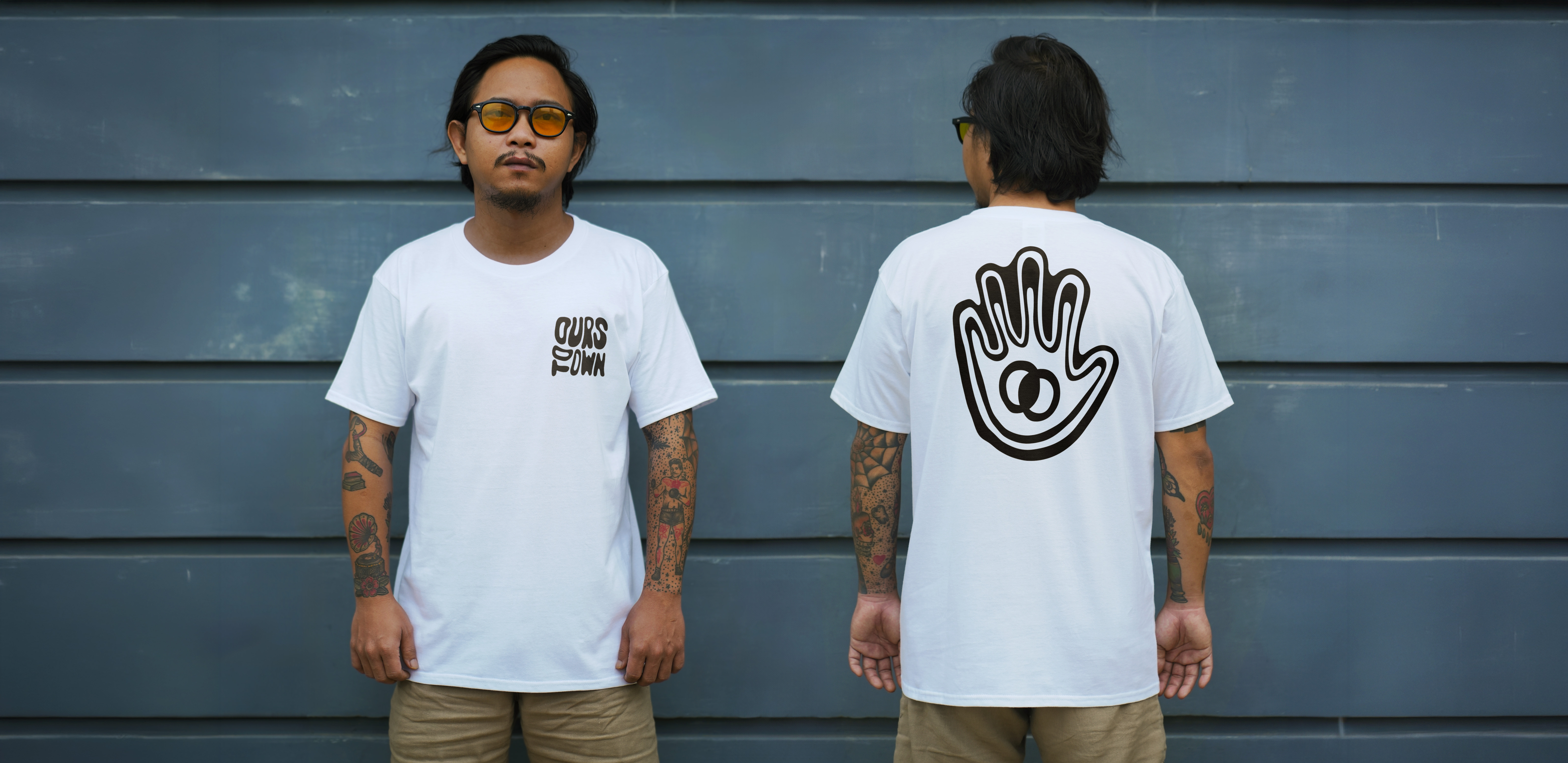 Front and back of a white Ours To Own t-shirt