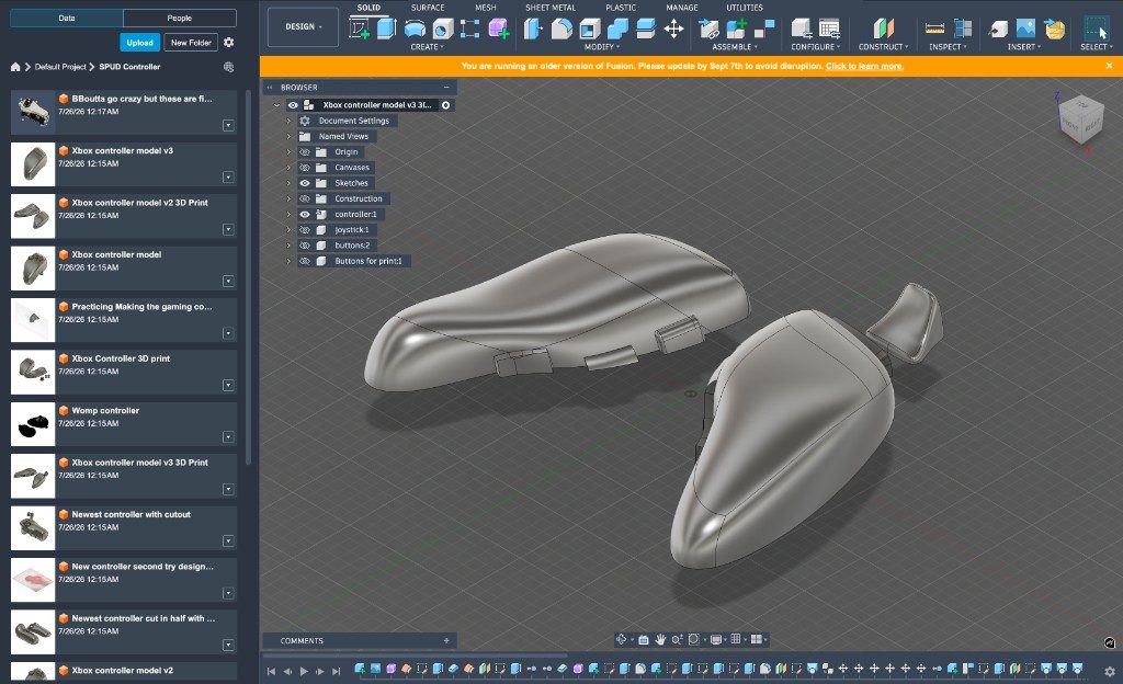 Fusion 360 view of early controller shells and a separate back piece on the modeling grid