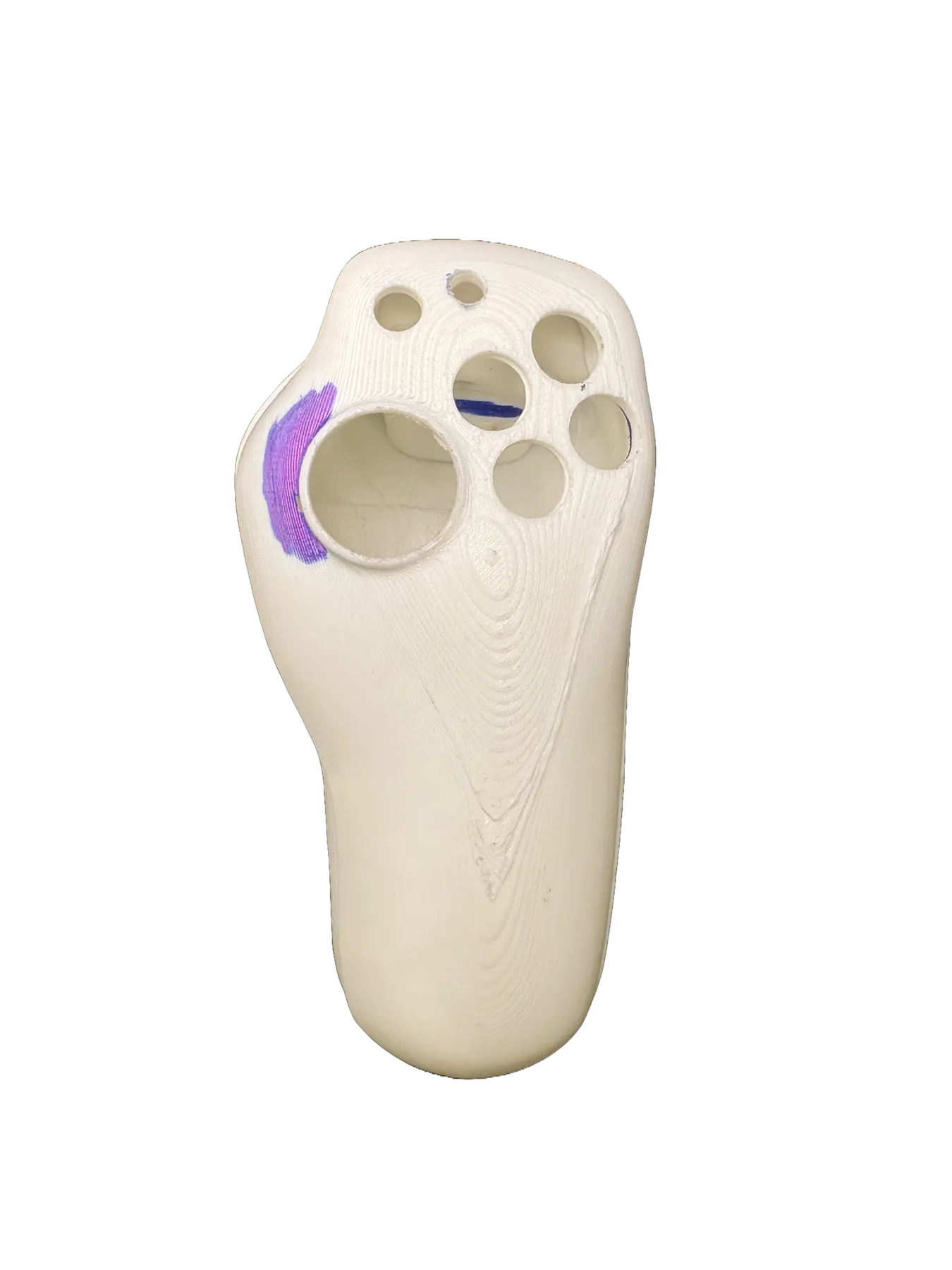 White shell with purple marker notes near the stick opening