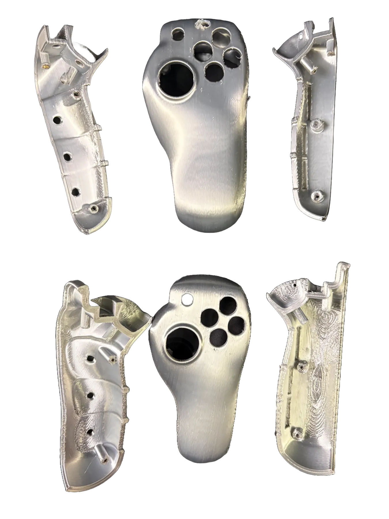 Silver controller shells arranged in two rows showing interior and exterior parts